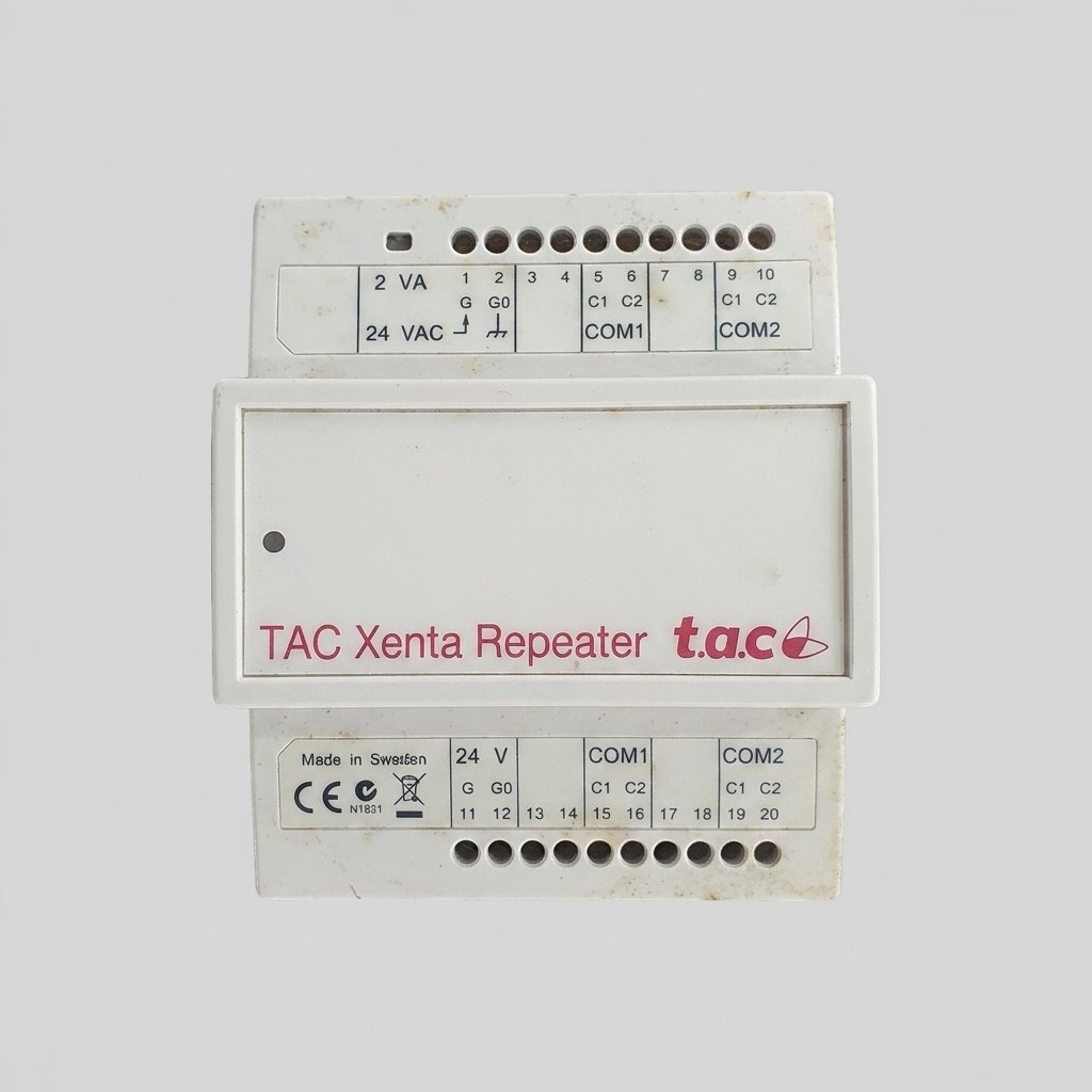 A front view of a white rectangular TAC Xenta Repeater module with various labeled terminal connections and text, on a plain grey background. The module shows some minor signs of wear or dirt.